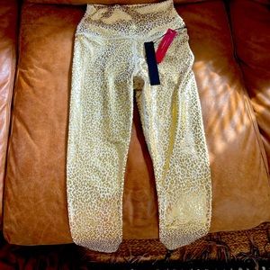 Carbon 38 tags on size xs gold metallic leggings